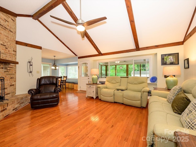 1047 Honeybee Trl, Fort Mill, SC 29715 - living area with light wood-style flooring, beam ceiling, a ceiling fan, a fireplace, and high vaulted ceiling