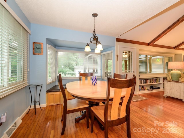 1047 Honeybee Trl, Fort Mill, SC 29715 - dining area featuring wood-type flooring, healthy amount of natural light, and a chandelier