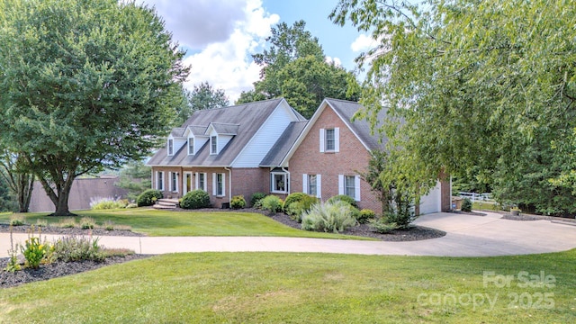 74 Challedon Dr, Candler, NC 28715 - cape cod-style house featuring brick siding, concrete driveway, a front lawn, and a garage