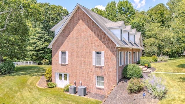 74 Challedon Dr, Candler, NC 28715 - view of property exterior featuring brick siding and a shingled roof