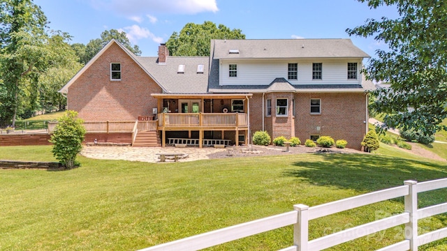 74 Challedon Dr, Candler, NC 28715 - rear view of property with a deck, a chimney, brick siding, and stairs