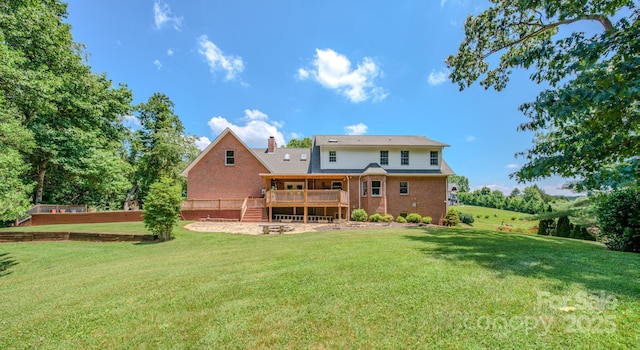 74 Challedon Dr, Candler, NC 28715 - rear view of property featuring a deck, a yard, brick siding, a chimney, and stairs