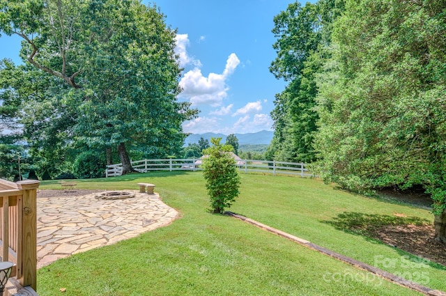 74 Challedon Dr, Candler, NC 28715 - view of yard with a patio area, a mountain view, and an outdoor fire pit