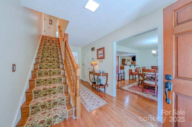 74 Challedon Dr, Candler, NC 28715 - staircase with wood finished floors and baseboards