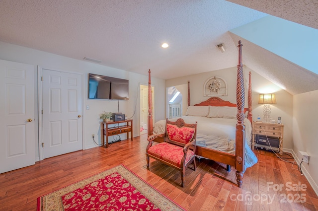 74 Challedon Dr, Candler, NC 28715 - bedroom featuring wood finished floors, a textured ceiling, and recessed lighting