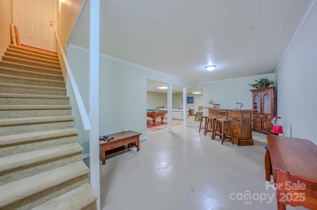 74 Challedon Dr, Candler, NC 28715 - dining room with a dry bar, stairs, concrete floors, and crown molding