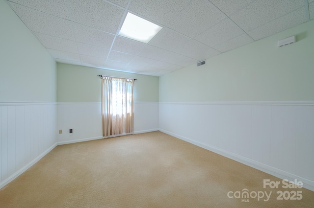 74 Challedon Dr, Candler, NC 28715 - empty room featuring a paneled ceiling, wainscoting, and carpet flooring