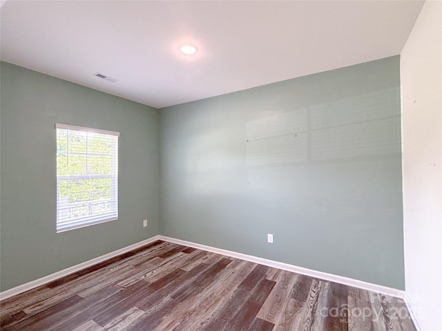 1542 Antioch Dr, Conover, NC 28613 - empty room with dark wood-type flooring and recessed lighting