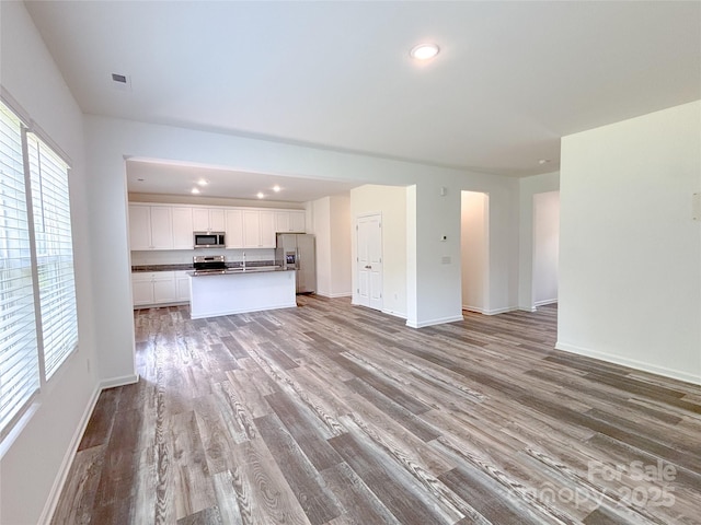 1542 Antioch Dr, Conover, NC 28613 - unfurnished living room featuring light wood finished floors and recessed lighting