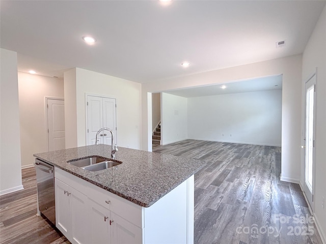 1542 Antioch Dr, Conover, NC 28613 - kitchen with stainless steel dishwasher, light wood-type flooring, white cabinets, stone countertops, and recessed lighting
