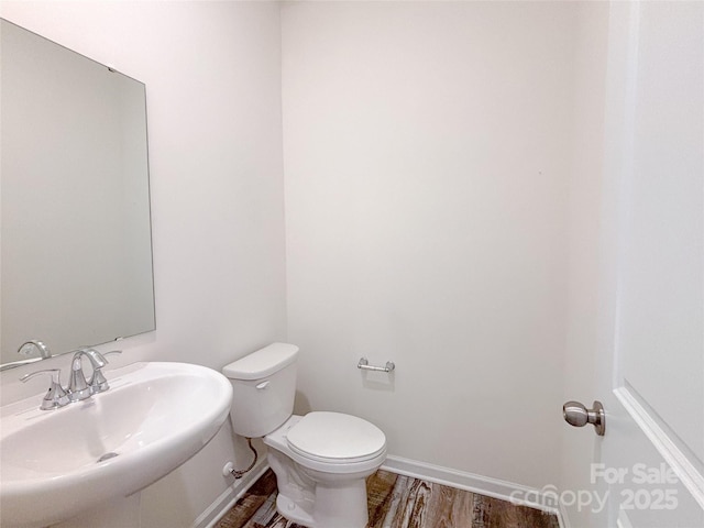 1542 Antioch Dr, Conover, NC 28613 - half bath featuring a sink and wood finished floors
