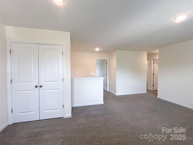 1542 Antioch Dr, Conover, NC 28613 - spare room with dark carpet and baseboards