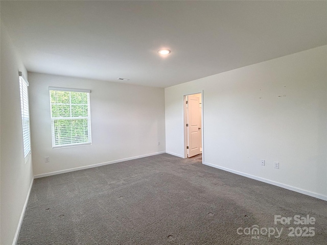 1542 Antioch Dr, Conover, NC 28613 - empty room featuring dark carpet and recessed lighting