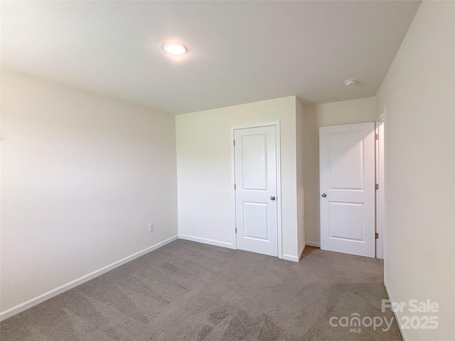 1542 Antioch Dr, Conover, NC 28613 - unfurnished bedroom with carpet floors and baseboards