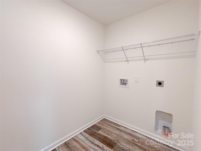1542 Antioch Dr, Conover, NC 28613 - laundry room featuring wood finished floors, hookup for an electric dryer, and washer hookup