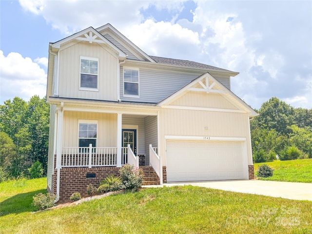 1542 Antioch Dr, Conover, NC 28613 - craftsman-style house with covered porch, an attached garage, a front lawn, and concrete driveway