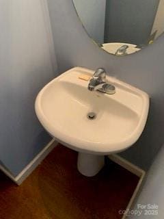 1422 Mitchell Glen St, Kannapolis, NC 28083 - bathroom featuring baseboards and a sink
