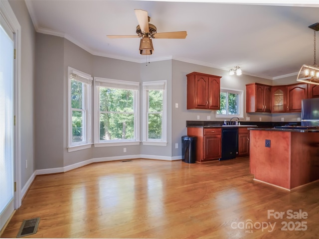 6620 Amos Smith Rd, Charlotte, NC 28214 - kitchen featuring dishwasher, freestanding refrigerator, dark countertops, light wood-style floors, and crown molding