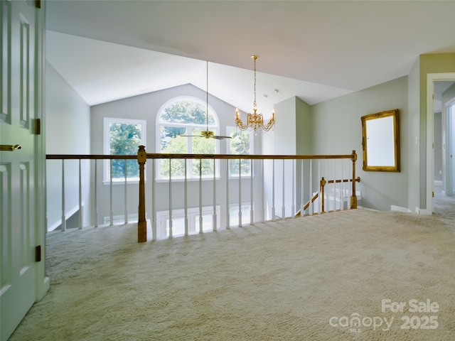6620 Amos Smith Rd, Charlotte, NC 28214 - spare room featuring carpet floors, lofted ceiling, and a chandelier