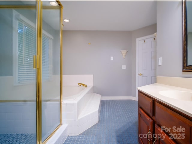 6620 Amos Smith Rd, Charlotte, NC 28214 - bathroom featuring vanity, tile patterned floors, a bath, a stall shower, and recessed lighting