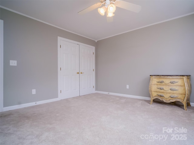 6620 Amos Smith Rd, Charlotte, NC 28214 - unfurnished bedroom featuring crown molding, carpet, a closet, and ceiling fan