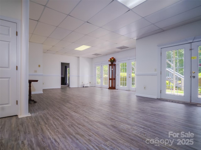 6620 Amos Smith Rd, Charlotte, NC 28214 - unfurnished room with french doors, a drop ceiling, and dark wood-style floors