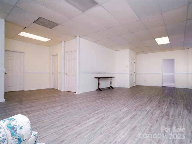 6620 Amos Smith Rd, Charlotte, NC 28214 - empty room with wood finished floors and a paneled ceiling
