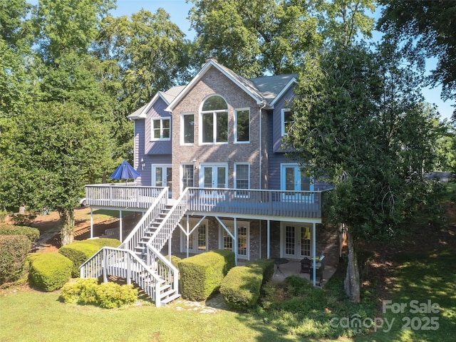 6620 Amos Smith Rd, Charlotte, NC 28214 - rear view of property featuring french doors, a deck, a patio, brick siding, and stairway