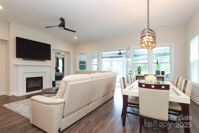 10240 Superb Ln, Charlotte, NC 28215 - dining area with a ceiling fan, dark wood-style flooring, a premium fireplace, recessed lighting, and a chandelier