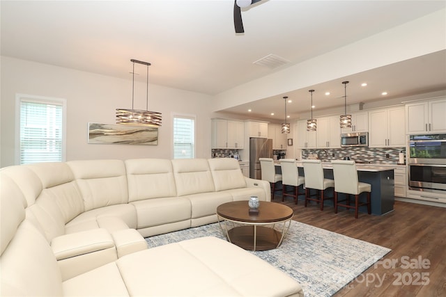 10240 Superb Ln, Charlotte, NC 28215 - living area featuring dark wood-style floors and recessed lighting