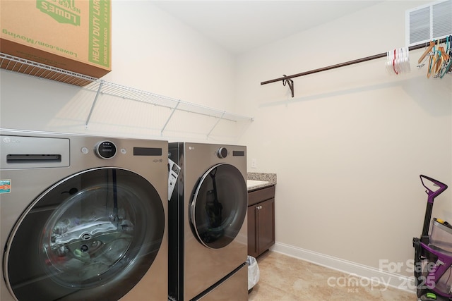 10240 Superb Ln, Charlotte, NC 28215 - washroom with washer and clothes dryer and cabinet space