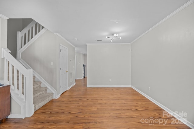 1778 Pergola Pl, Charlotte, NC 28213 - unfurnished room featuring stairs, wood finished floors, and ornamental molding