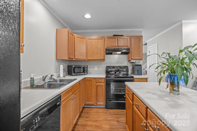 1778 Pergola Pl, Charlotte, NC 28213 - kitchen with black appliances, under cabinet range hood, crown molding, light wood-style floors, and light countertops