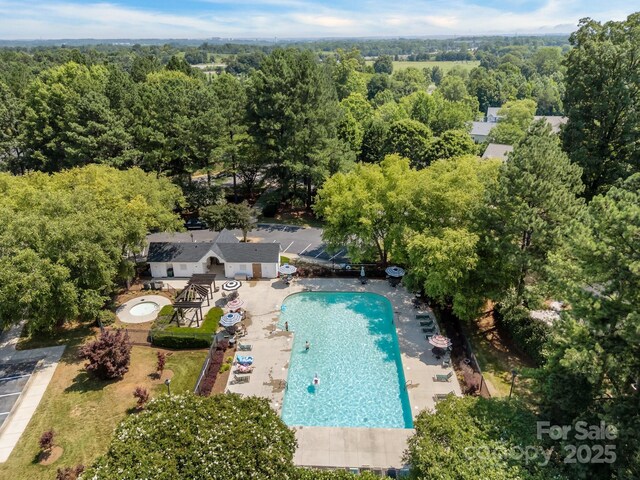 1778 Pergola Pl, Charlotte, NC 28213 - bird's eye view of a pool and a heavily wooded area