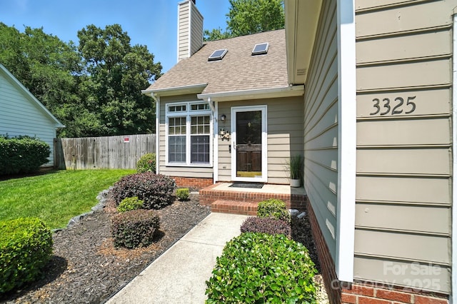 3325 Fortis Ln, Matthews, NC 28105 - property entrance featuring a chimney and a shingled roof
