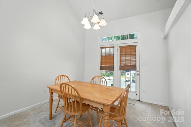 3325 Fortis Ln, Matthews, NC 28105 - dining room featuring a chandelier, light colored carpet, healthy amount of natural light, and high vaulted ceiling