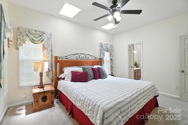 3325 Fortis Ln, Matthews, NC 28105 - bedroom featuring a skylight, light carpet, multiple windows, and ensuite bath