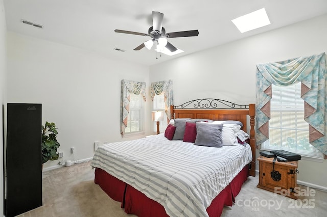 3325 Fortis Ln, Matthews, NC 28105 - carpeted bedroom with a skylight and a ceiling fan