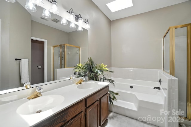 3325 Fortis Ln, Matthews, NC 28105 - full bathroom featuring a skylight, a stall shower, a garden tub, and double vanity