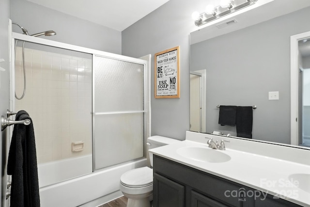 3325 Fortis Ln, Matthews, NC 28105 - full bathroom with vanity, bath / shower combo with glass door, and wood finished floors