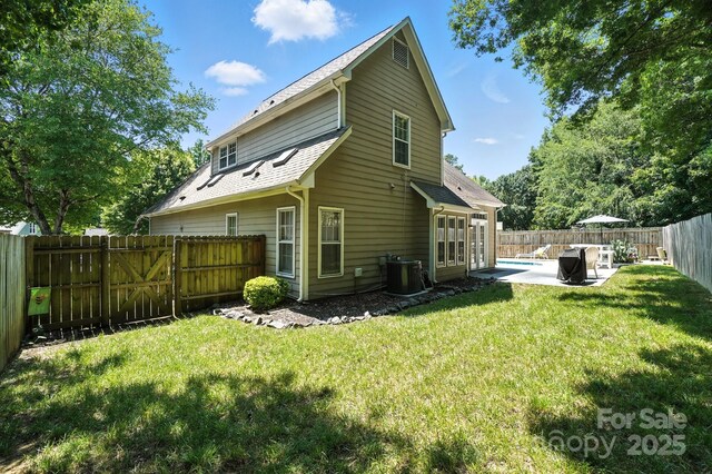 3325 Fortis Ln, Matthews, NC 28105 - rear view of house with a patio and a fenced backyard