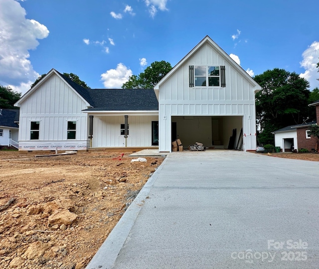 1678 Sharon Ln Unit 12, Lancaster, SC 29720 - modern farmhouse style home featuring board and batten siding, driveway, roof with shingles, and a porch
