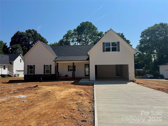 1678 Sharon Ln Unit 12, Lancaster, SC 29720 - modern inspired farmhouse featuring driveway, board and batten siding, an attached garage, and a porch