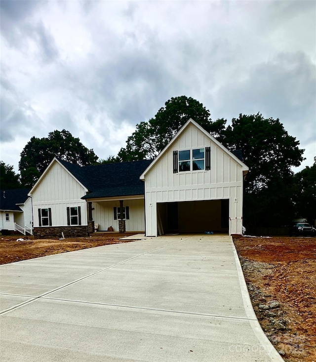 1678 Sharon Ln Unit 12, Lancaster, SC 29720 - modern inspired farmhouse featuring board and batten siding, concrete driveway, and an attached garage