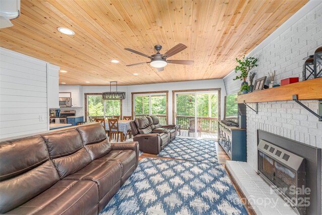477 Locust Dr, Maggie Valley, NC 28751 - living area featuring wooden ceiling, recessed lighting, a ceiling fan, and a brick fireplace