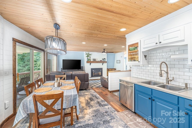 477 Locust Dr, Maggie Valley, NC 28751 - kitchen featuring blue cabinets, wooden ceiling, stainless steel dishwasher, light wood finished floors, and a ceiling fan