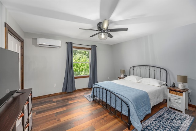 477 Locust Dr, Maggie Valley, NC 28751 - bedroom featuring a wall mounted air conditioner, wood finished floors, and ceiling fan