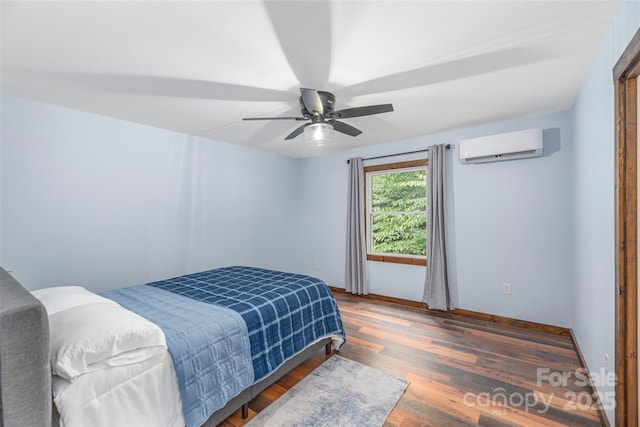 477 Locust Dr, Maggie Valley, NC 28751 - bedroom featuring a wall unit AC, wood finished floors, and a ceiling fan