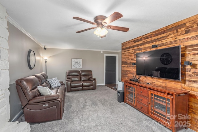 477 Locust Dr, Maggie Valley, NC 28751 - living area featuring wooden walls, a ceiling fan, crown molding, carpet floors, and an accent wall