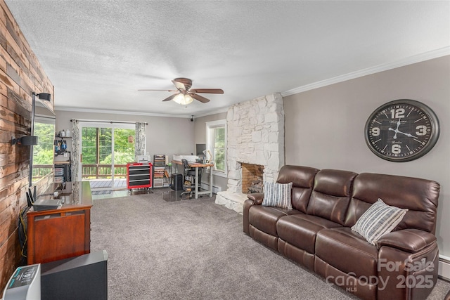 477 Locust Dr, Maggie Valley, NC 28751 - living room with carpet flooring, ornamental molding, a ceiling fan, a fireplace, and a textured ceiling